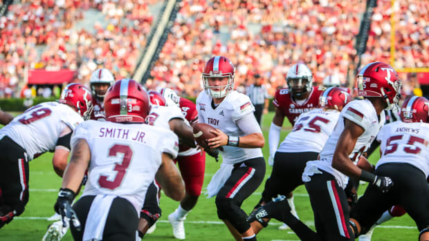 Troy Trojans quarterback Taylor Powell (7) looks to hand off to running back B.J. Smith (3) in the second quarter against the South Carolina Gamecocks Williams-Brice Stadium.